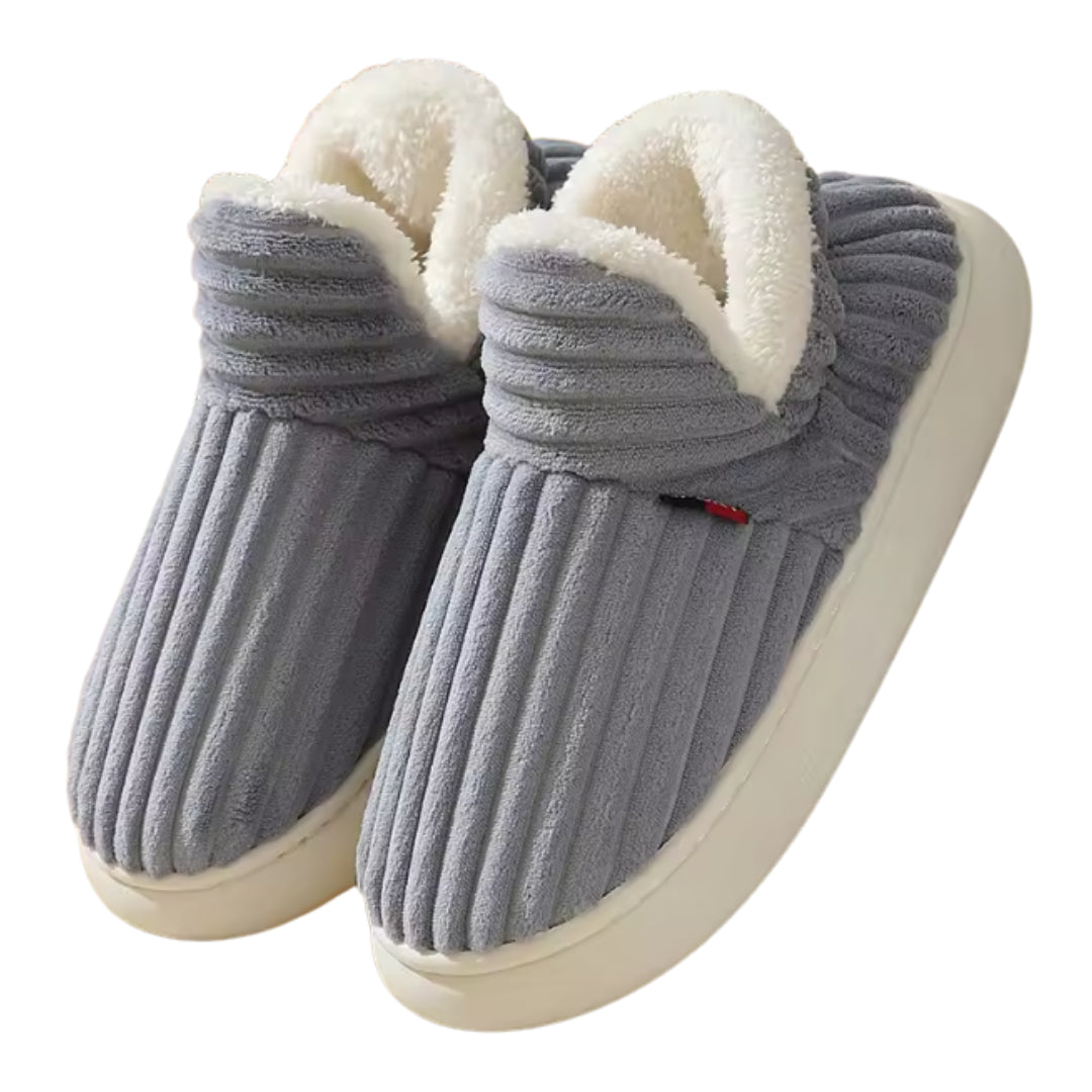 Graue Cord-Hausschuhe mit weißem Fellfutter, seitliche Ansicht